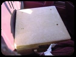 Typewriter case in backseat